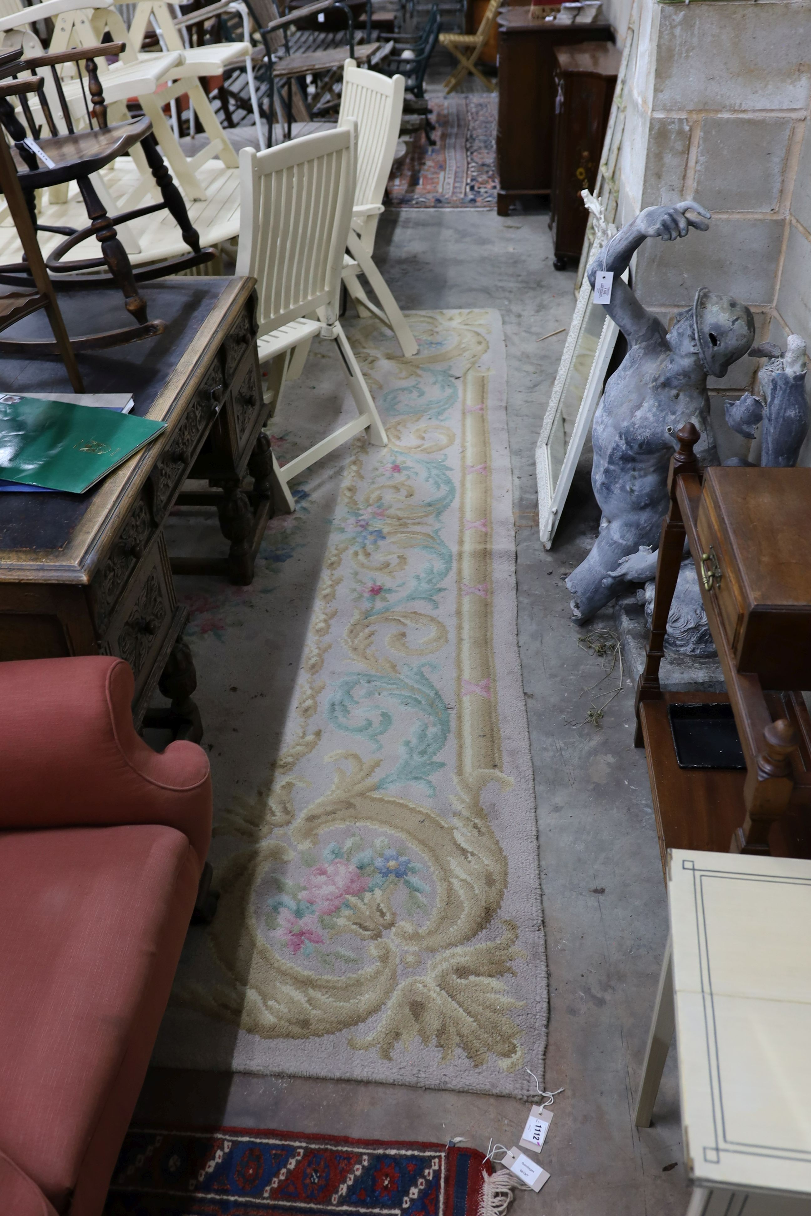 An Aubusson style fawn ground wool carpet, 360 x 260cm